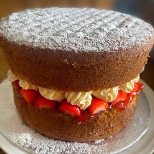 Victoria Sponge Cake with strawberries and strawberry jam with cream pipe filling. Burton Farm, Local Farm shop, Chippenham.