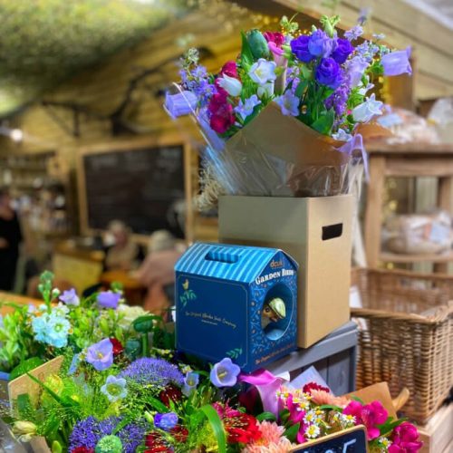 Inside the shop display, display of colourful bunches of flowers. Burton Farm, Local Farm shop, Chippenham.