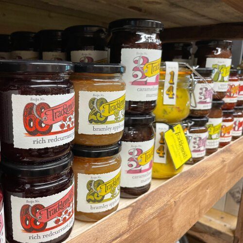 Jars of curds and marmalades on display for sale. Burton Farm, Local Farm shop, Chippenham.